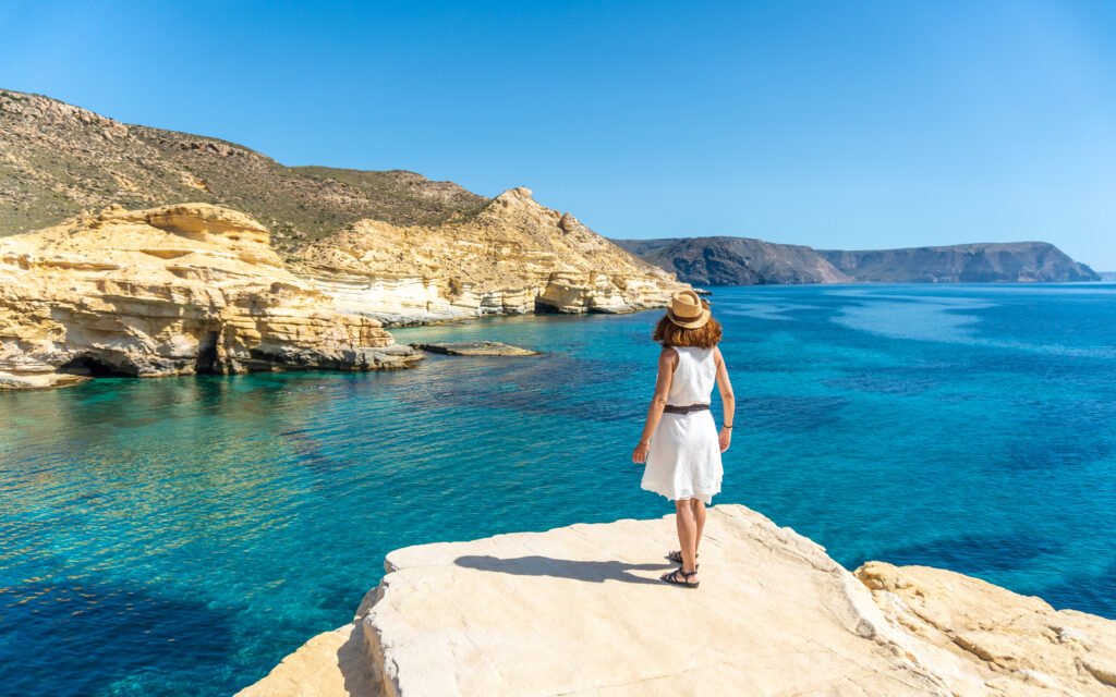 A young woman looking at the sea in Rodalquilar in Cabo de Gata